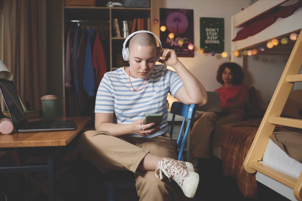 Two Female Students In College Dorm Room